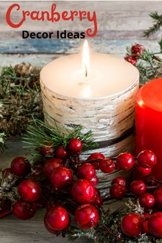 a candle and some berries on a table