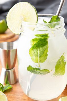 a mason jar filled with limeade and mint