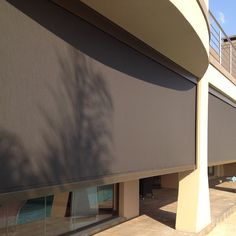 an outside view of a building with blinds on the windows