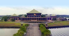 an aerial view of a large building near the water