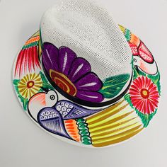 If you buy a product that is not available immediately for shipping, your whole order will be shipped together when all products are available. Otomí Hats Hand-painted in TAXCO,GUERRERO. Beautifully hand-painted Otomí designed hats made in Taxco. All designs vary, as they are hand painted, which means your hat will be unique and one-of a kind! Size: L (come with an adjustable elastic on the inside) Hand painted. Measurements: Inside: 25" circumference (elastic gives +/- 1 inch variation), Entire Painted Tote Bag, Painted Purse, Mexican Hat, Mexican Fashion, Colorful Hat, Handpainted Bags, Modern Mexican, Painted Hats, Painted Tote