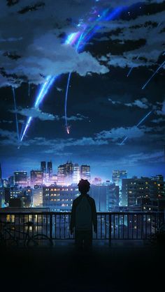 a man looking at fireworks in the sky