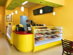 the inside of a donut shop filled with lots of doughnuts and pastries