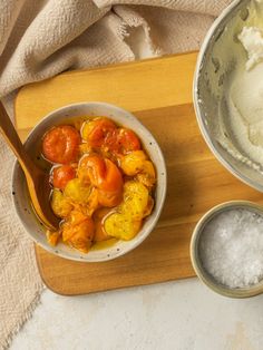 a bowl filled with food next to two bowls full of ice cream and other items