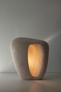 a light that is sitting on top of a table in the middle of a room