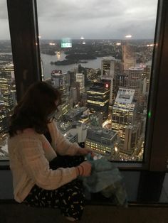 Girl sitting on a window looking over the city lights City Light, Big Photo, Person Sitting, Future Apartment, Drawing Stuff, People Sitting, Girly Images, Beautiful Sights, Photo Inspo