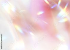 an abstract blurry background with white and pink colors