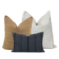 three pillows in different colors and sizes