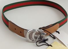 Brand new with tags Gucci girls boys GG green red green web stripe belt L 432707 GA 1 Tighten up your look. Crafted from the GRG web fabric ended in a beige leather, this GG logo belt from Gucci Kids is all your little one will need to put their outfit together on their own. Featuring an adjustable fastening, a buckle fastening, a leather strap and POSITIVELY CONSCIOUS:  Made in Italy   • Gucci Web fabric and leather ending • Metallic GG buckle • Adjustable model • Made in Italy Hypoallergenic p Green Web, Red Web, Gucci Kids, Gg Logo, Gucci Belt, Red Green, Leather Straps, Buckle, Gucci