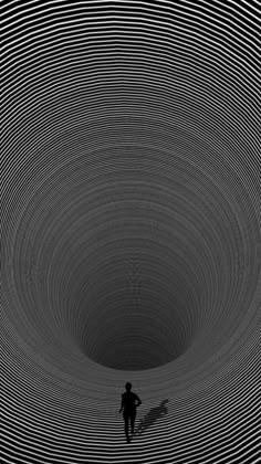 a person standing in the middle of a black and white tunnel with circles on it