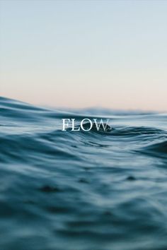 the word flow is floating on top of an ocean wave in front of a blue sky