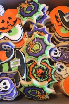 decorated cookies in the shape of halloween characters