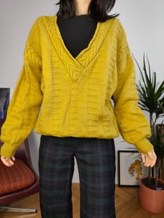 DESCRIPTION Fabulous vintage cable knit sweater in a bright mustard yellow with deep V neck. This is a thick and warm pullover.  CONDITION This vintage knit is in great vintage condition with only very light signs of wear (lightly deformed V neck collar) SIZING This vintage knit is estimated as size M > please check measurements below as all vintage sizes are different Measurements: Arms till shoulder seam: 50cm Shoulders: 71cm Armpit to armpit: 57cm Back: 67cm Model is size XS/S and is 1m65 MATERIAL No label, feels like wool or wool blend WITH LOVE  All vintage items are washed/treated from Berlin with a lot of love As they are all one of a kind, they might have some small imperfections. The clear flaws will be described under condition. Your favourite online vintage clothing shop  By Jen Yellow V-neck Sweater Affordable, Vintage Clothing Online, Pullover Sweater Women, Wool Blend Sweater, Vintage Knitting, Winter Knits, Vintage Wool, Neck Collar, Women Pullover