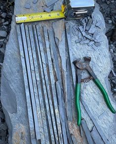 tools are laying on top of some rocks