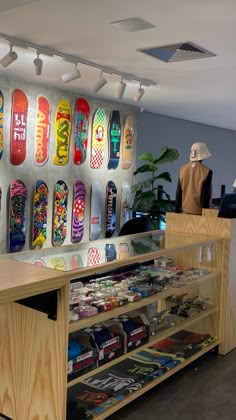 there are many skateboards on display in the store