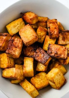 the best ever air fryer tofu in a white bowl with text overlay