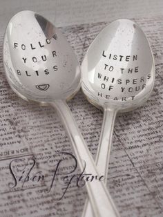 two spoons with words written on them