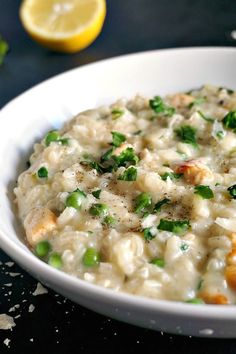 a white bowl filled with rice and peas