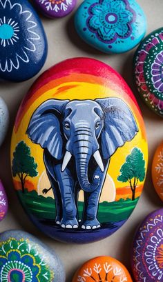 colorful painted rocks with an elephant on them