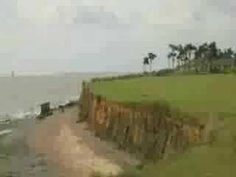 an artistic view of the ocean and cliffs