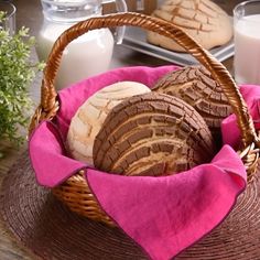 a basket filled with cookies sitting on top of a table