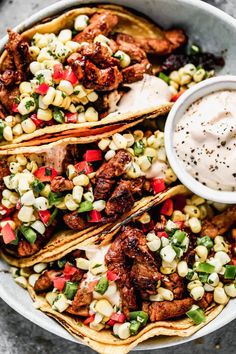 chicken fajita with corn and ranch dressing in a bowl