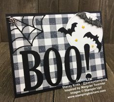 a black and white halloween card with the word boo on it