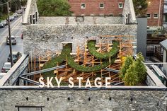 an aerial view of the sky stage sign on top of a building with scaffolding