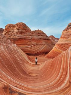 a person standing in the middle of an area that looks like it is made out of rock