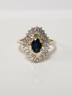 "Thanks for shopping our vintage estate store. We tend to sell well below wholesale and truly hope you enjoy all of our items. Many of the items are one of a kind, so please enjoy scrolling through the pictures and hopefully something will catch your eye. Black spots are from camera or reflections. Estate 10k yellow gold natural oval .50ct sapphire .50ct diamond cocktail style ring. There are 22 baguette diamonds in the setting, and the sapphire is testing natural. Ring size: 6.75 Setting: 3/4\" Diamond Ring Band, Cocktail Vintage, Baguette Diamonds, Sapphire Diamond Ring, Wedding Cocktails, Diamond Rings Bands, Black Spot, Baguette Diamond, Ring Band