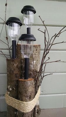 three lights are on top of a tree stump