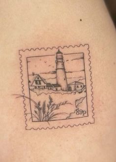 a stamp with a lighthouse on it is shown in black and grey ink, as well as an image of the ocean