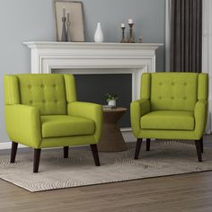 two lime green chairs in front of a fireplace