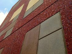 a red brick building with some windows on the side