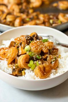 a white bowl filled with shrimp and rice