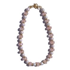 Yareia Necklace in Rose Quartz and Natural Pearls The Yareia Necklace in Rose Quartz is a delicate blend of soft, blushing rose quartz, lustrous freshwater pearls, and warm gold accents. This elegant piece features alternating rose quartz disc beads and natural water pearls, with each section separated by gold-flecked spacers that enhance its subtle charm. Finished with a handcrafted Marne clasp, this necklace embodies a refined, feminine grace. Key Features:- Rose quartz disc beads with soft pi Healing Goddess, Luxurious Necklace, Half And Half, Rose Quartz Necklace, Forever Jewelry, Jewelry Ring Box, Water Pearls, Men's Jewelry Rings, Stone Gold