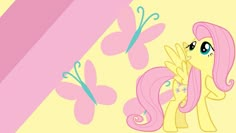 the pink pony is standing next to a butterfly