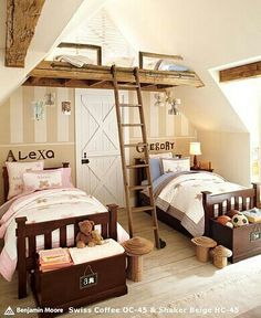 two children's beds in a attic bedroom with wooden ladders to the ceiling