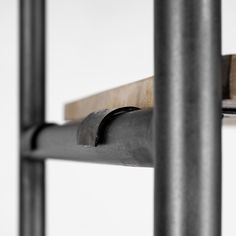 a close up view of the metal frame and wood slats on a white background