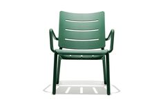 a green plastic chair on a white background