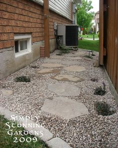 a stone path in front of a house