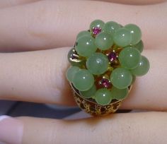 New Vintage 14k Yellow Solid Gold Nugget Large Ring With Genuine Jade & Rubies       The top of the Ring is 19mm by 21mm. Ring Size 5 1/2.   Weights 16.0 grams with original tag from 1980s YOU ARE BIDDING OR BUYING ON A GORGEOUS, 100% GUARANTEED AUTHENTIC PIECE OF JEWELRY.      ALL OUR ITEMS, JEWELRY AND STONES ARE TESTED AND GUARANTEED. WE DO NOT OFFER ANY WARRANTIES, ALL ITEMS ARE SOLD AS IS.    DO NOT MISS THIS OPPORTUNITY TO PURCHASE A UNIQUE PIECE OF JEWELRY AT A GREAT PRICE! FEEL FREE TO CONTACT US IF YOU HAVE ANY QUESTIONS OR WOULD LIKE ANY ADDITIONAL PHOTOS! *PLEASE NOTE: ALL OUR PICTURES ARE TAKEN OF THE ACTUAL ITEM YOU WILL RECEIVE* PAYMENT IS EXPECTED WITHIN 48 HOURS OF CLOSE OF AUCTION OR SALE.   -ALL DOMESTIC ORDERS ARE FULLY INSURED AND SHIPPED VIA USPS. INTERNATIONAL SHIPPIN Pineapple Ring, Pineapple Rings, Gold Nugget, Large Ring, The Ring, Ring Gold, New Vintage, Quality Jewelry, Unique Pieces