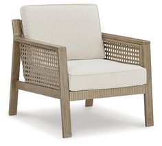 an outdoor chair with white cushions and wicker back rests against a white background,