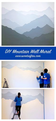 two people painting mountains on the wall with blue and white paint, while another person is using a ladder