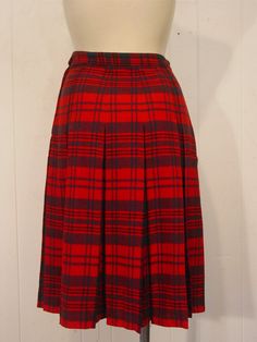 "Vintage 1950s skirt. Made of red and green plaid wool. Has a side zipper. No label. Size small. Actual measurements are: 26.5\" at the waist 41\" around the hips 25.5\" overall length. In very good condition." Scottish Red Skirt For Fall, Vintage Plaid Pleated Skirt For Fall, Vintage Plaid Full Skirt, Scottish Style Fitted Plaid Pleated Skirt, Vintage Pleated Plaid Skirt, Fitted Vintage Plaid Skirt, Retro Plaid Full Skirt, Retro Full Skirt In Plaid, Retro Full Plaid Skirt