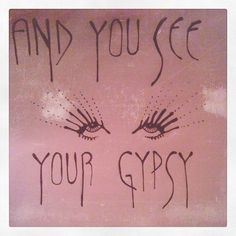 graffiti written on the side of a pink wall with words and an image of eyes