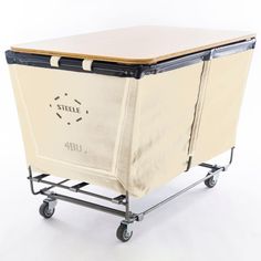 a cart with wheels and a canvas bag on the top that says steele bbu