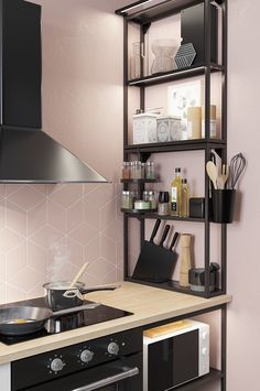 a stove top oven sitting next to a shelf filled with cooking utensils and other kitchen items