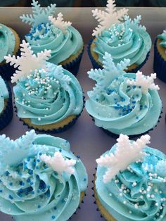 blue frosted cupcakes with snowflakes on them