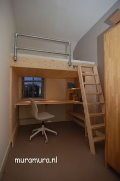 there is a loft bed with a desk and ladder to the top bunk, next to an office chair